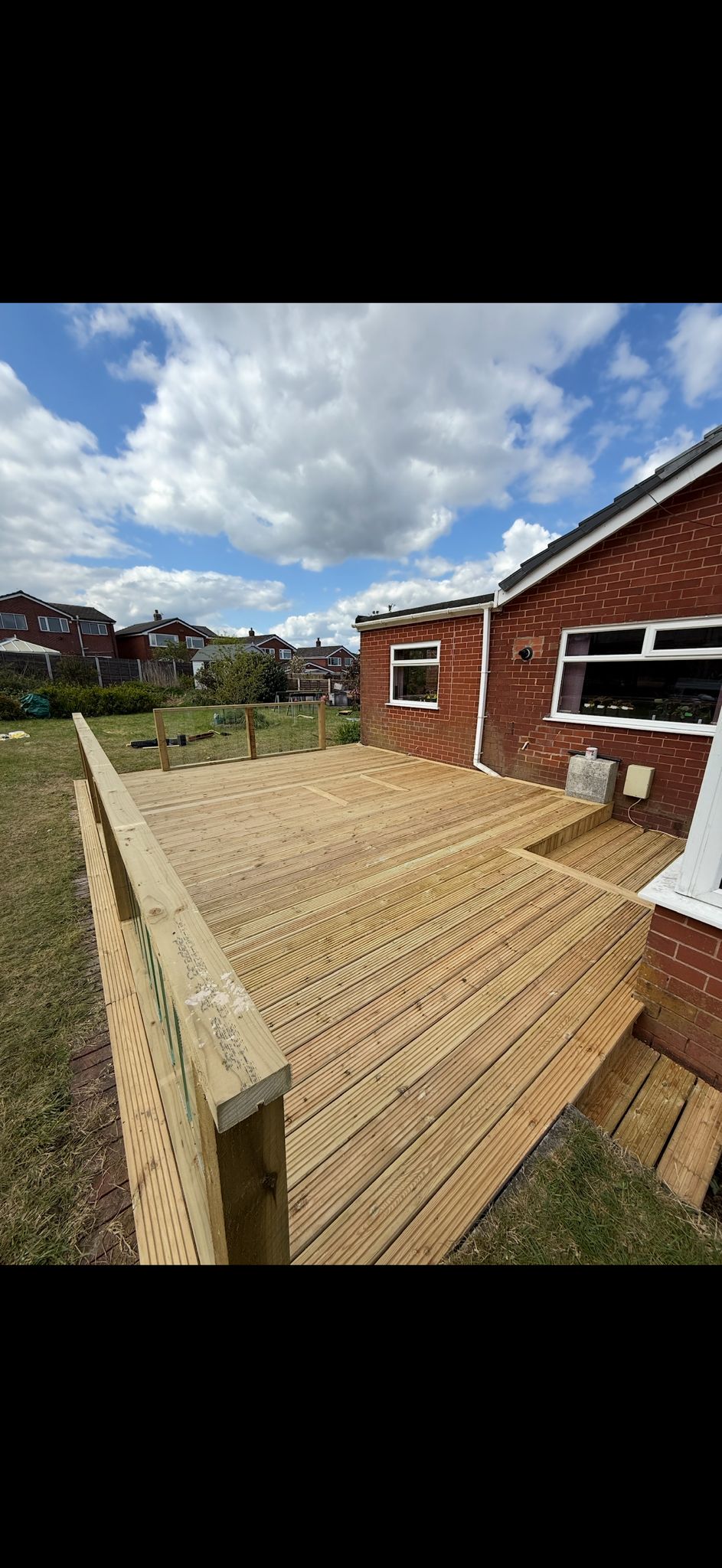Fresh timber decking on a brick bungalow
